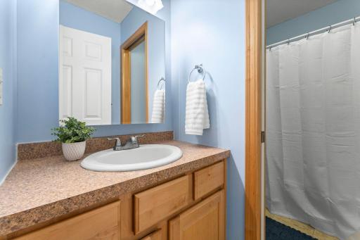 Well planned bathroom has separate vanity area with privacy door. Ideal for simultaneous use.