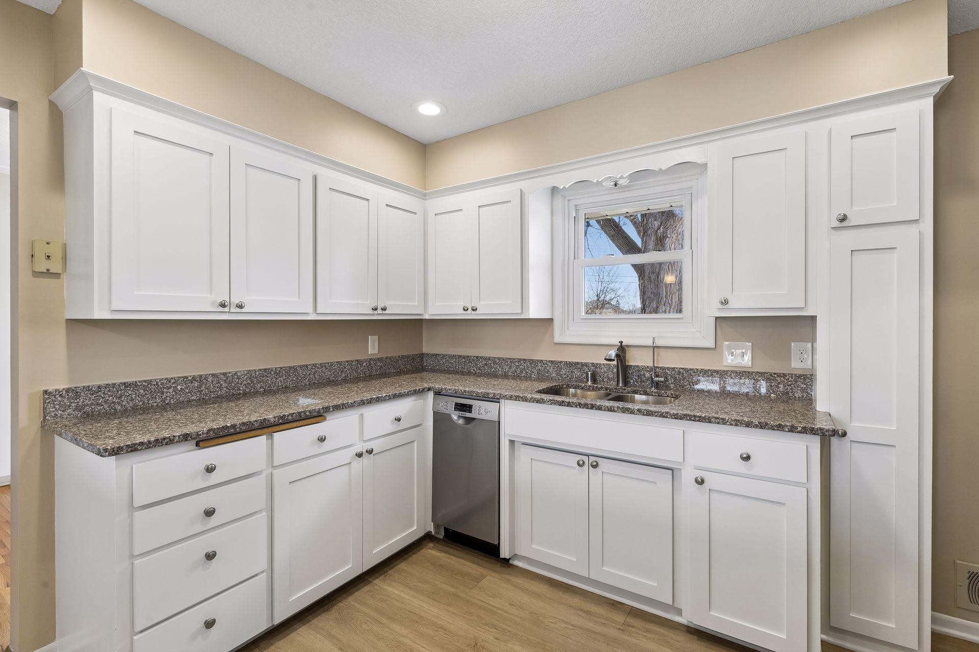 The kitchen has generous cabinet and counter space.