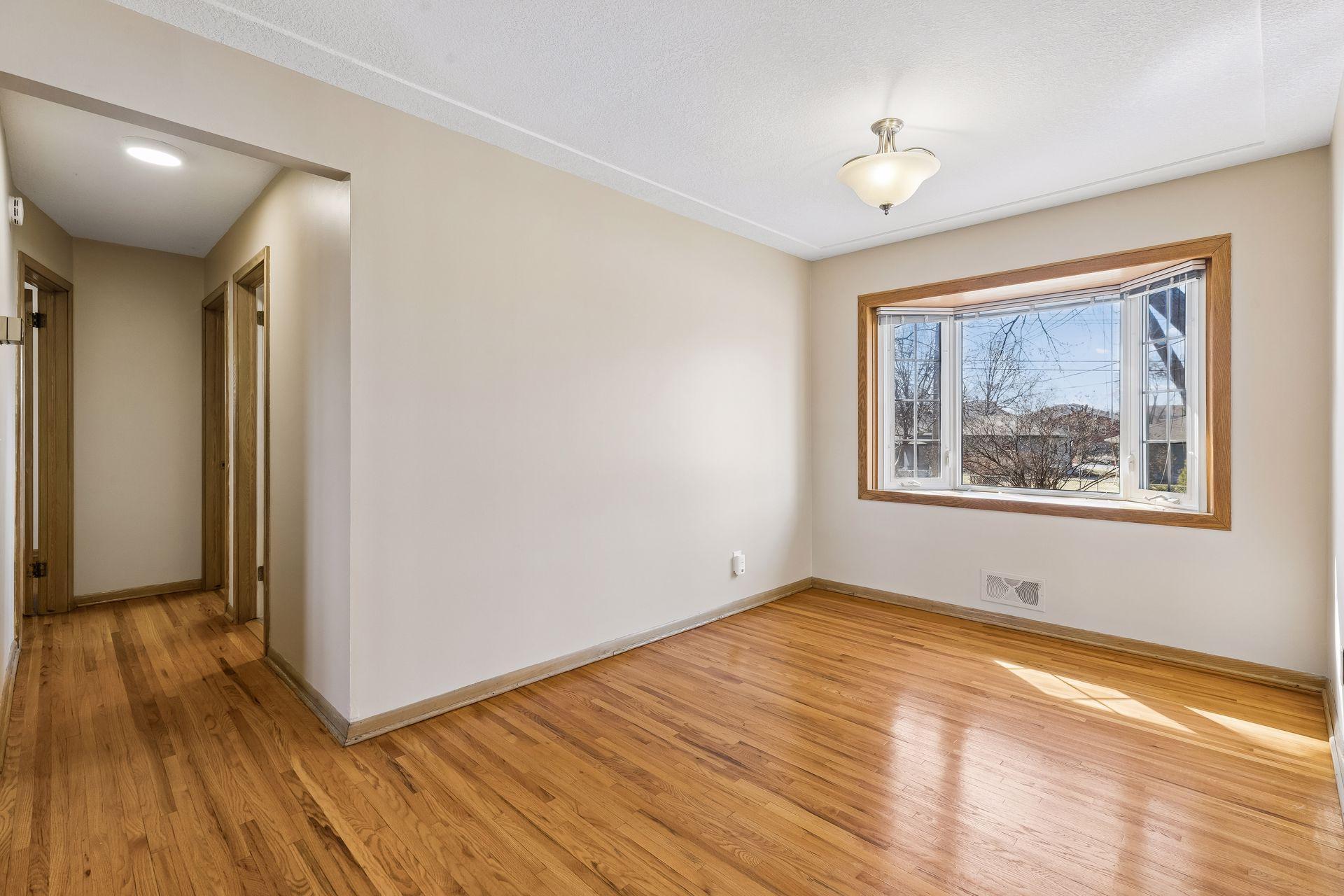 The dining room has a beautiful bay window.