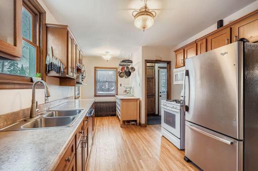 Spacious kitchen was eaten nook and beautiful cabinets.