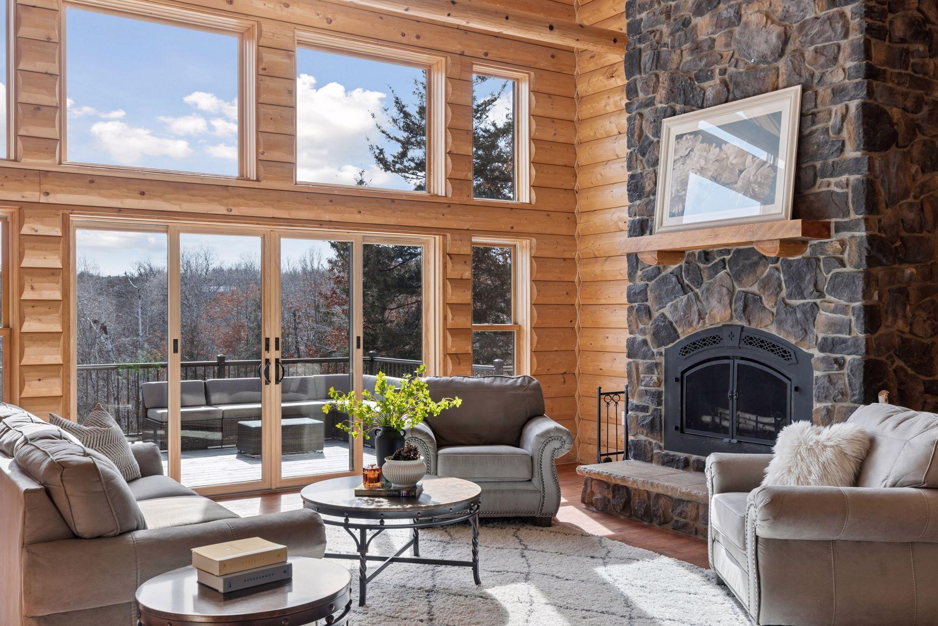 Sun-filled living space with expansive windows and seamless access to the deck