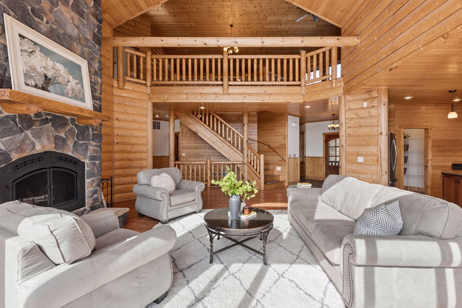 Spacious main living area with loft overlook and stunning timber craftsmanship