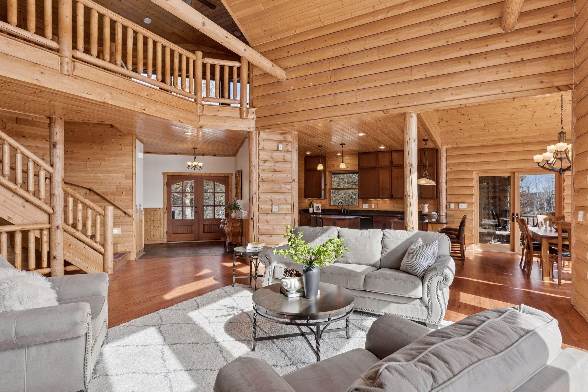 Spacious main living area with loft overlook and stunning timber craftsmanship