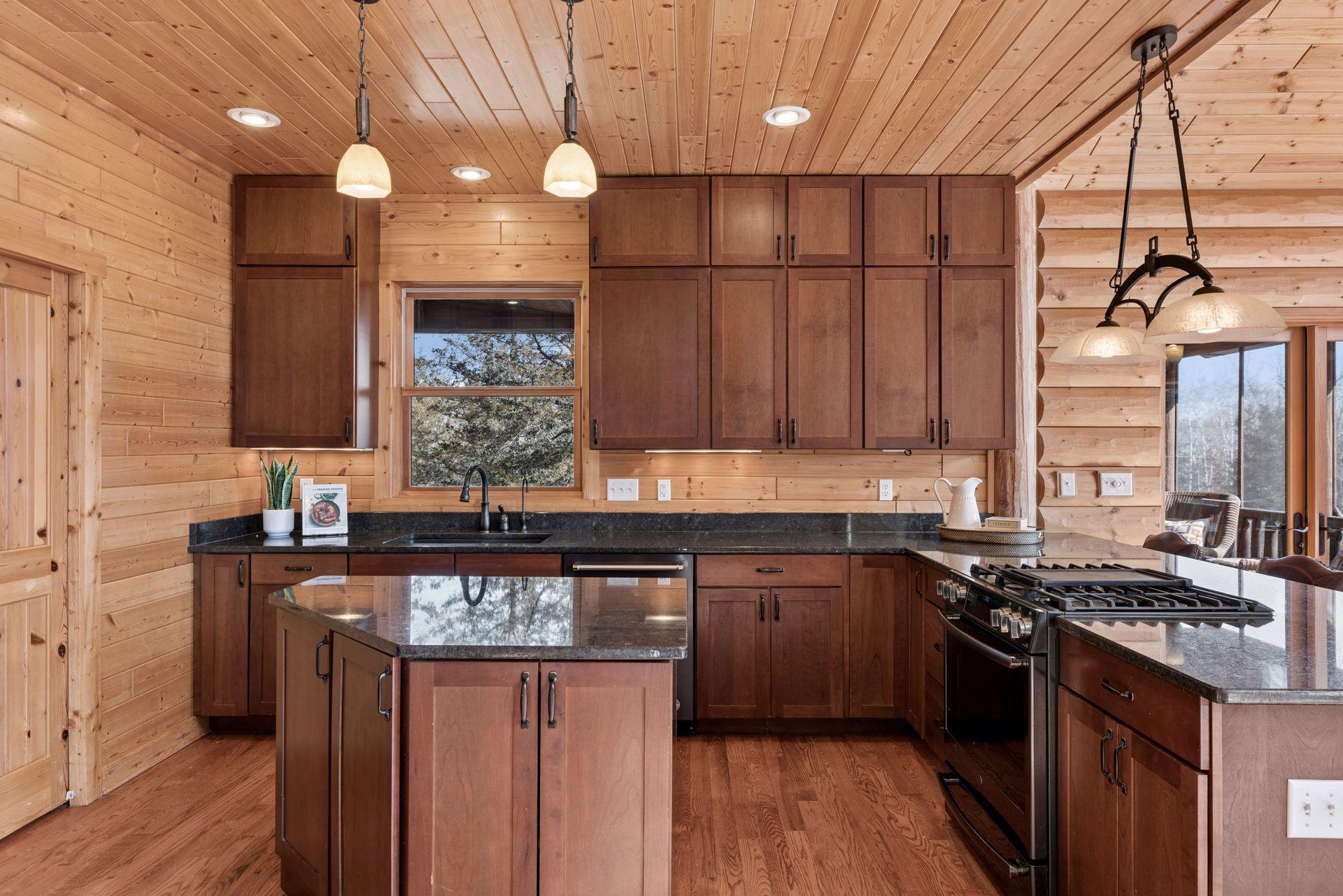 Well-appointed kitchen with granite countertops, center island, and custom cabinetry