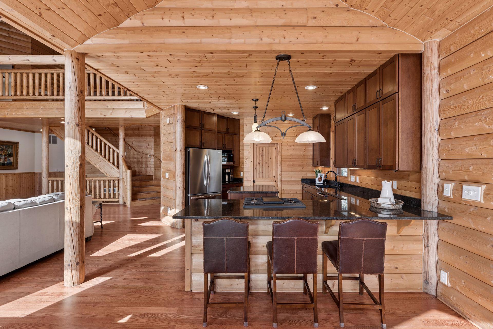 Kitchen with breakfast bar seating, pendant lighting, and stainless steel appliances