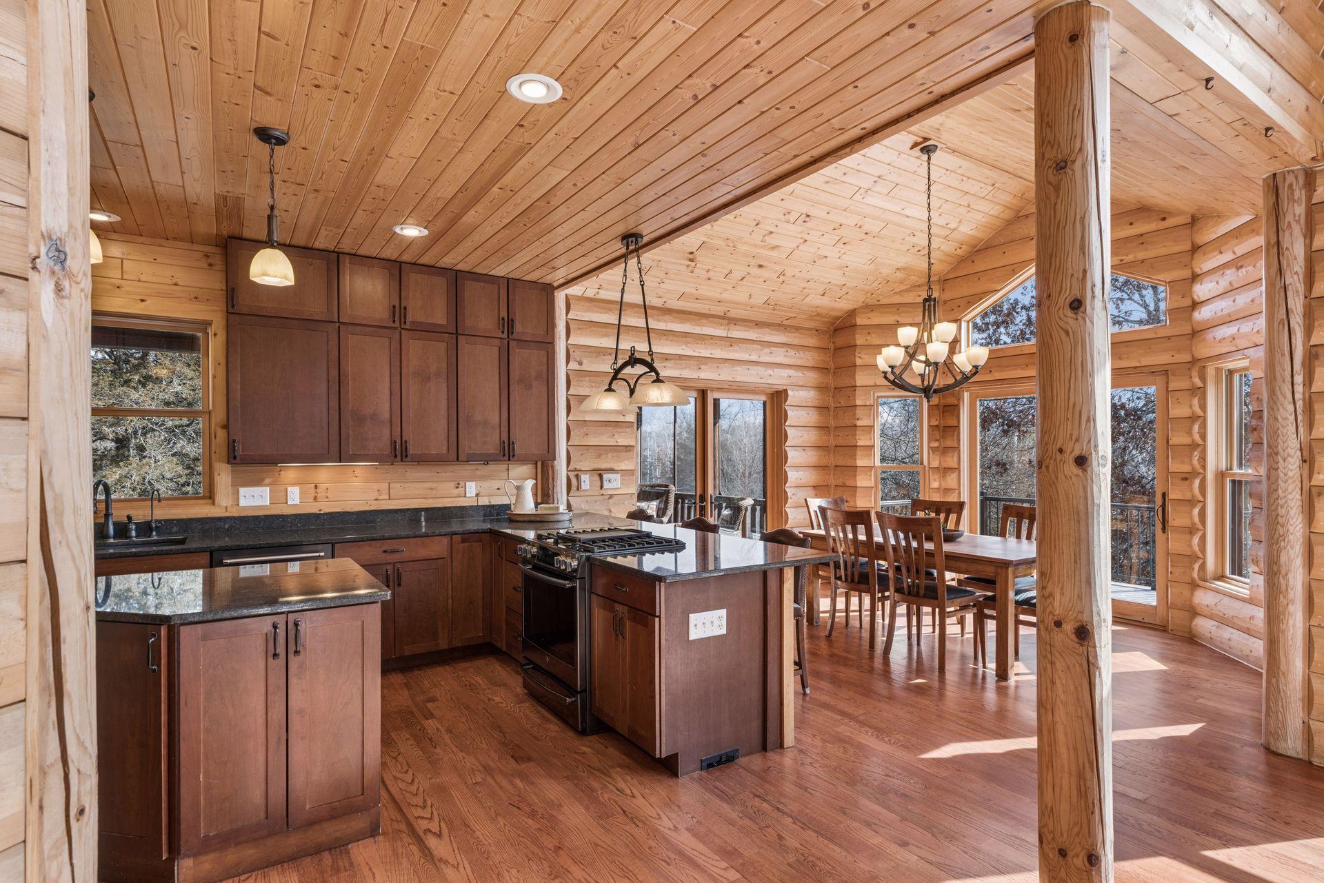 Open-concept kitchen and dining with vaulted ceilings and abundant natural light