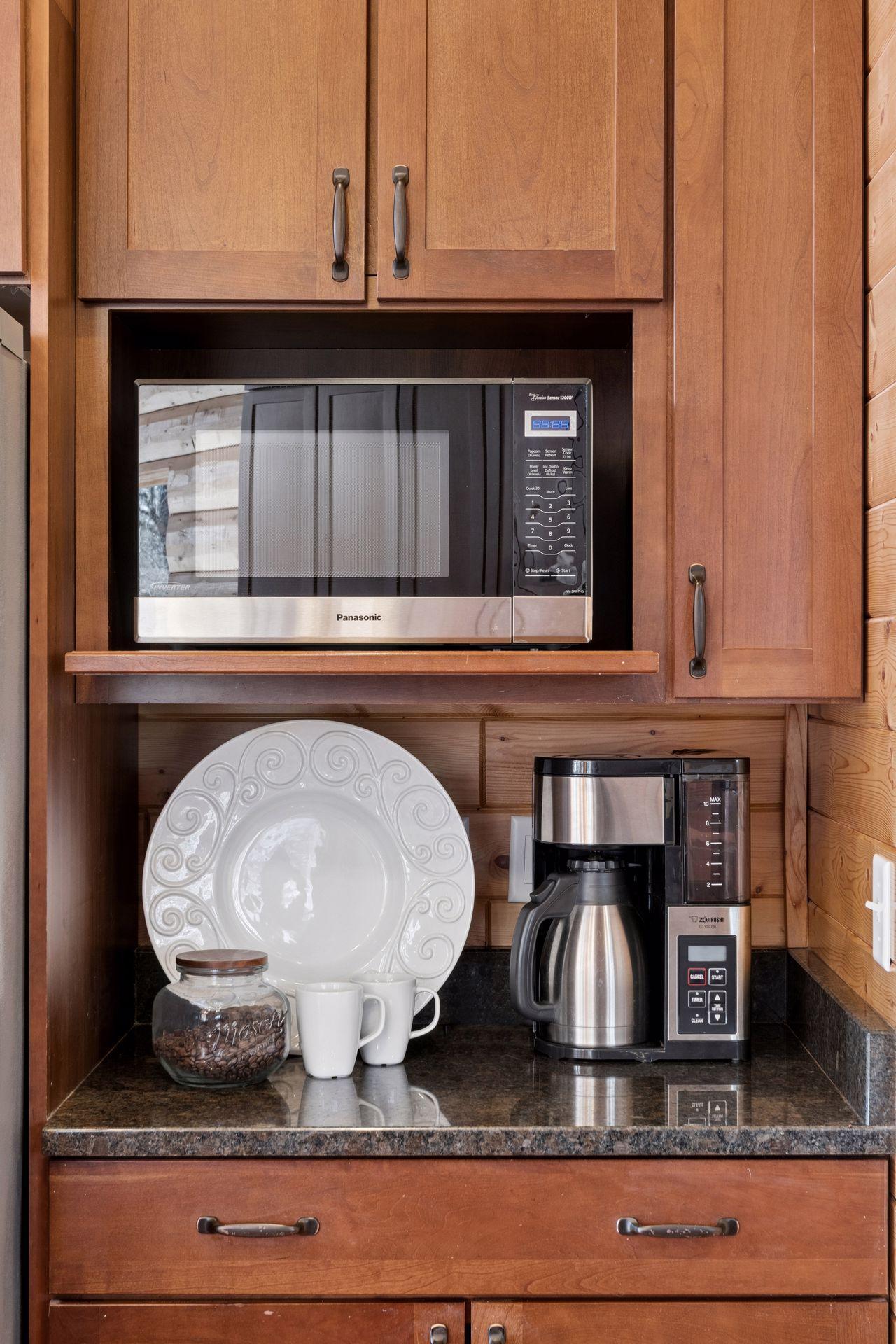 Built-in microwave and coffee station for added convenience