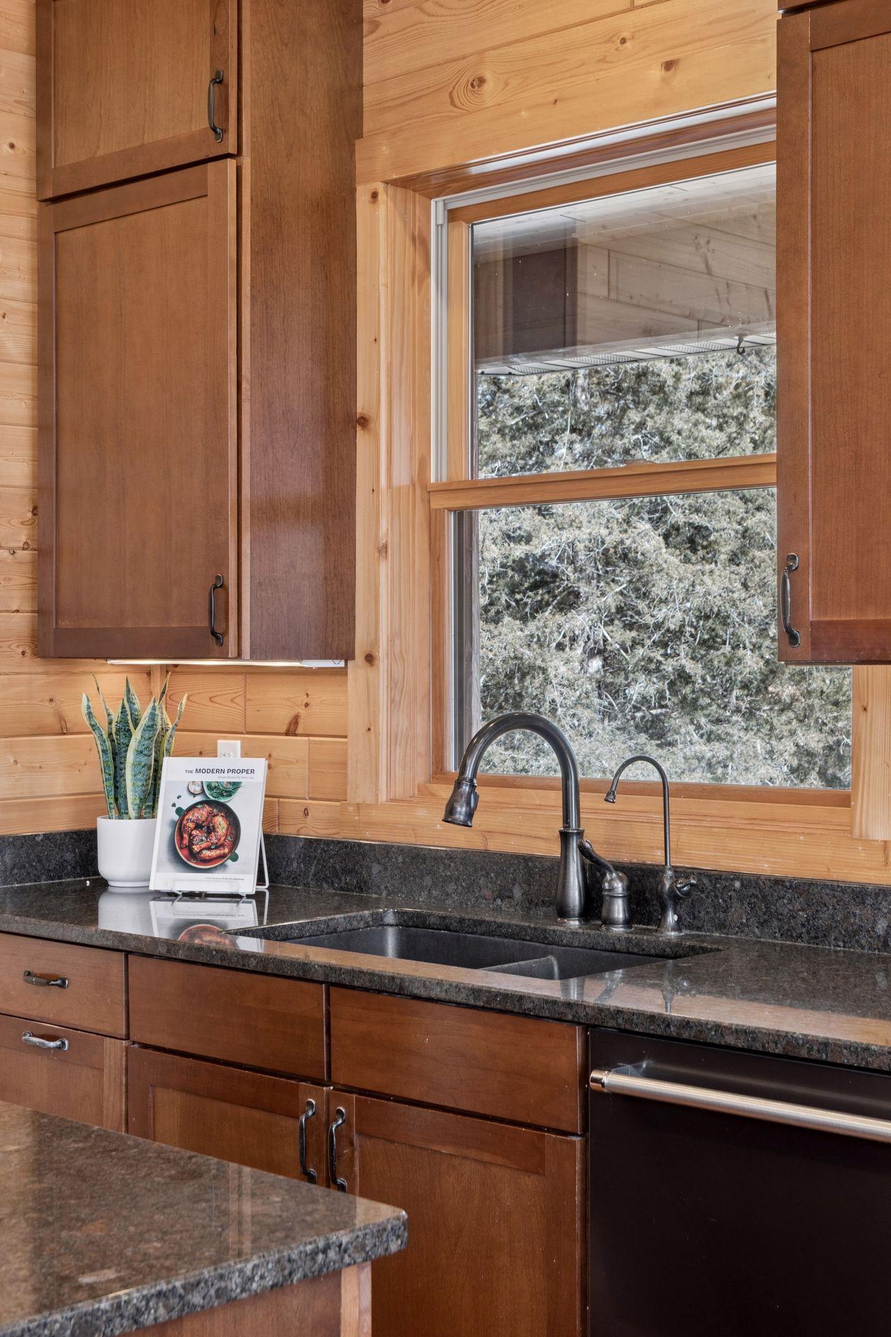 Kitchen sink with window overlooking peaceful natural surroundings