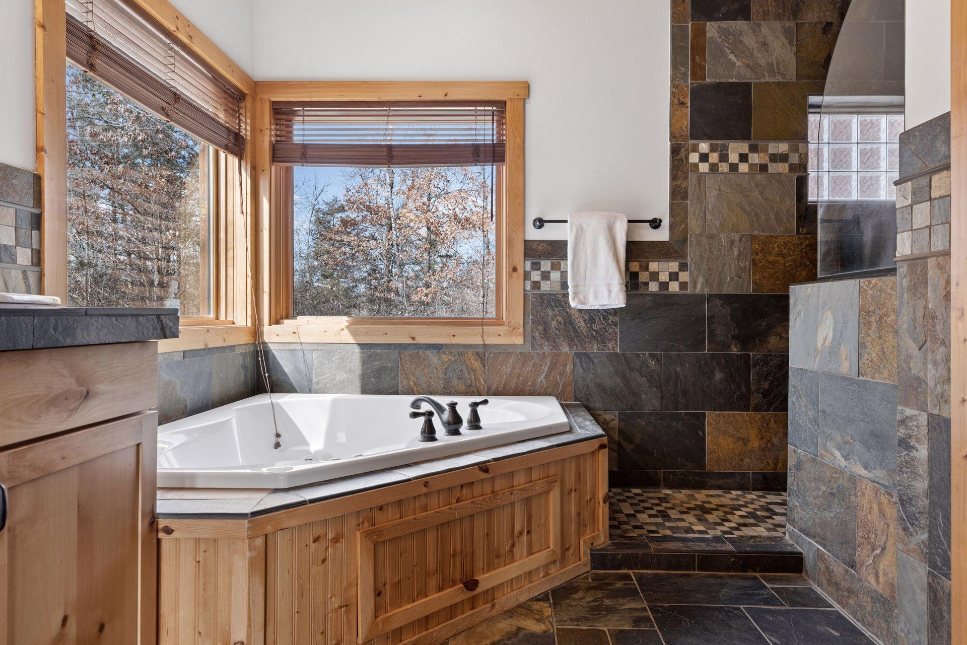 Spa-like bathroom with corner soaking tub and walk-in tile shower