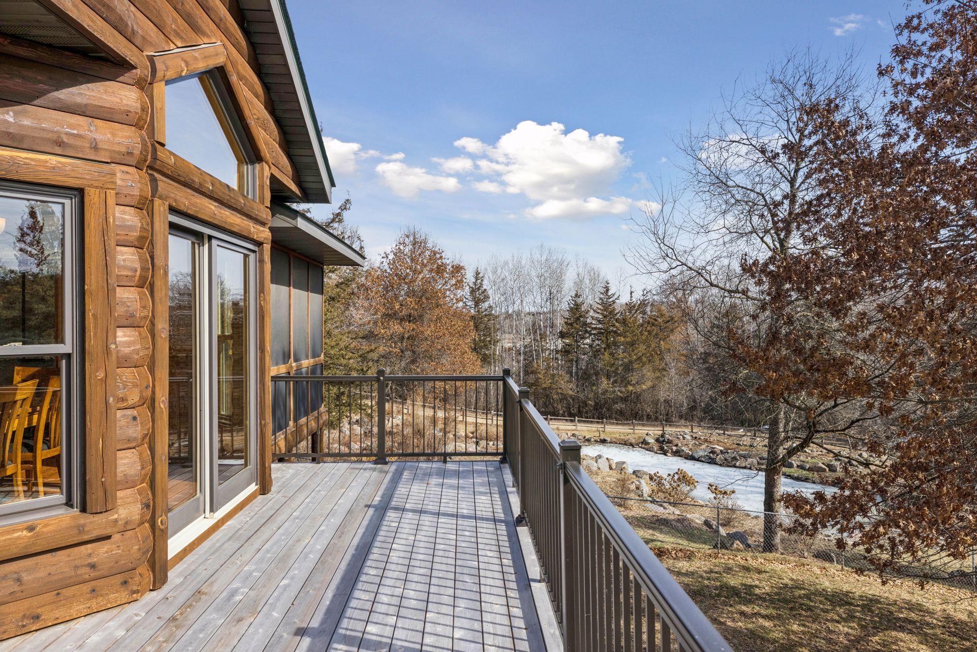 Serene backyard views with open green space and wooded privacy.