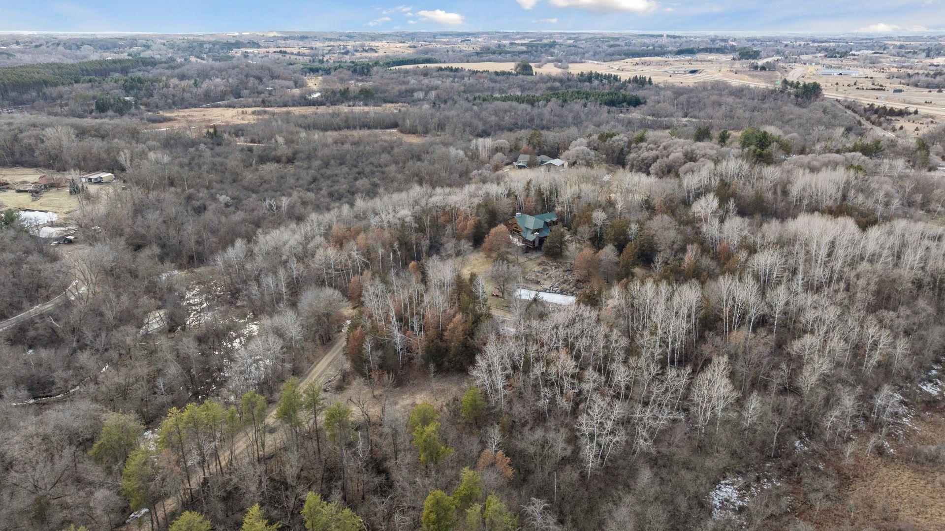 24 acres of wooded privacy and natural beauty