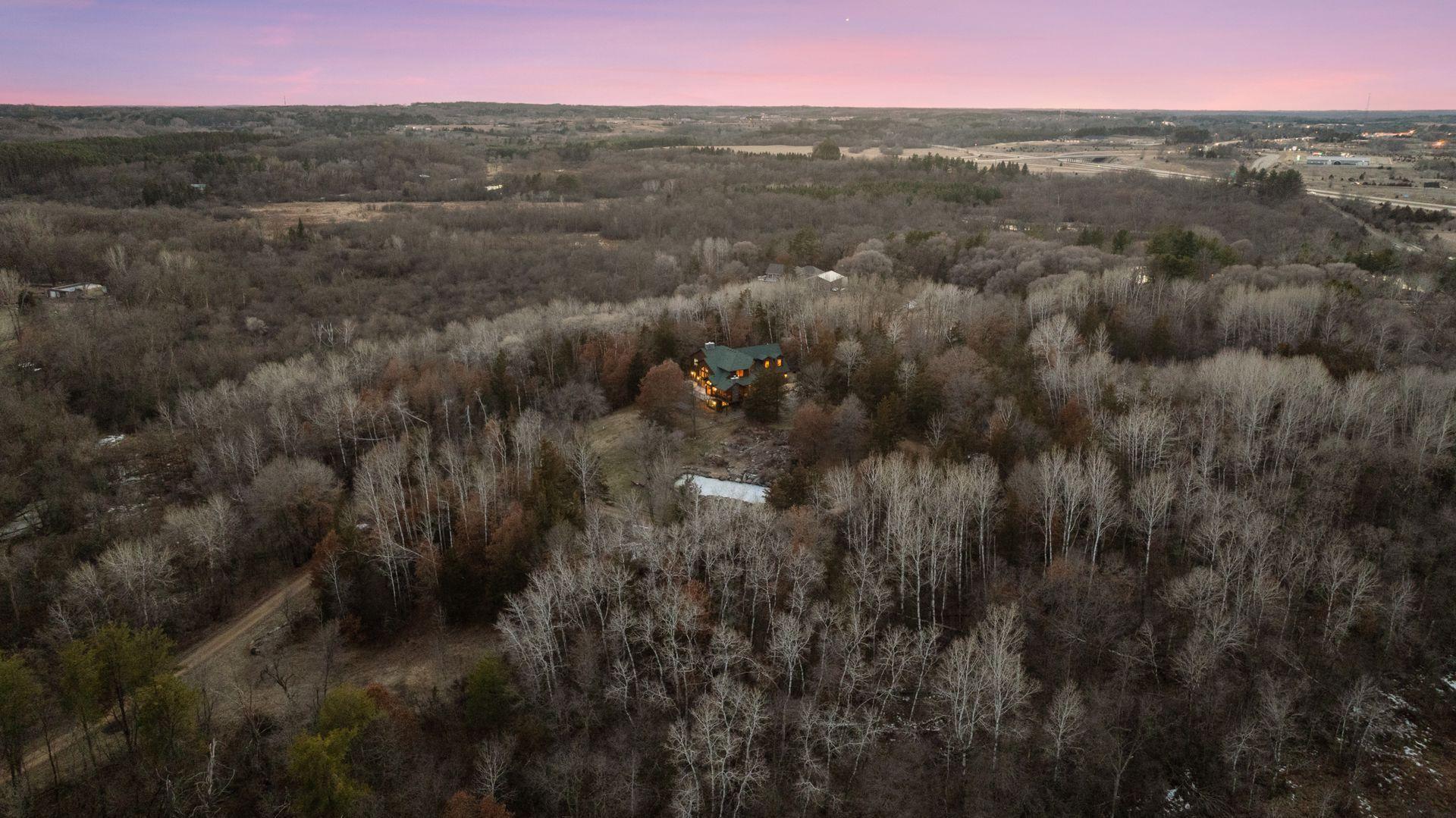 24 acres of wooded privacy and natural beauty