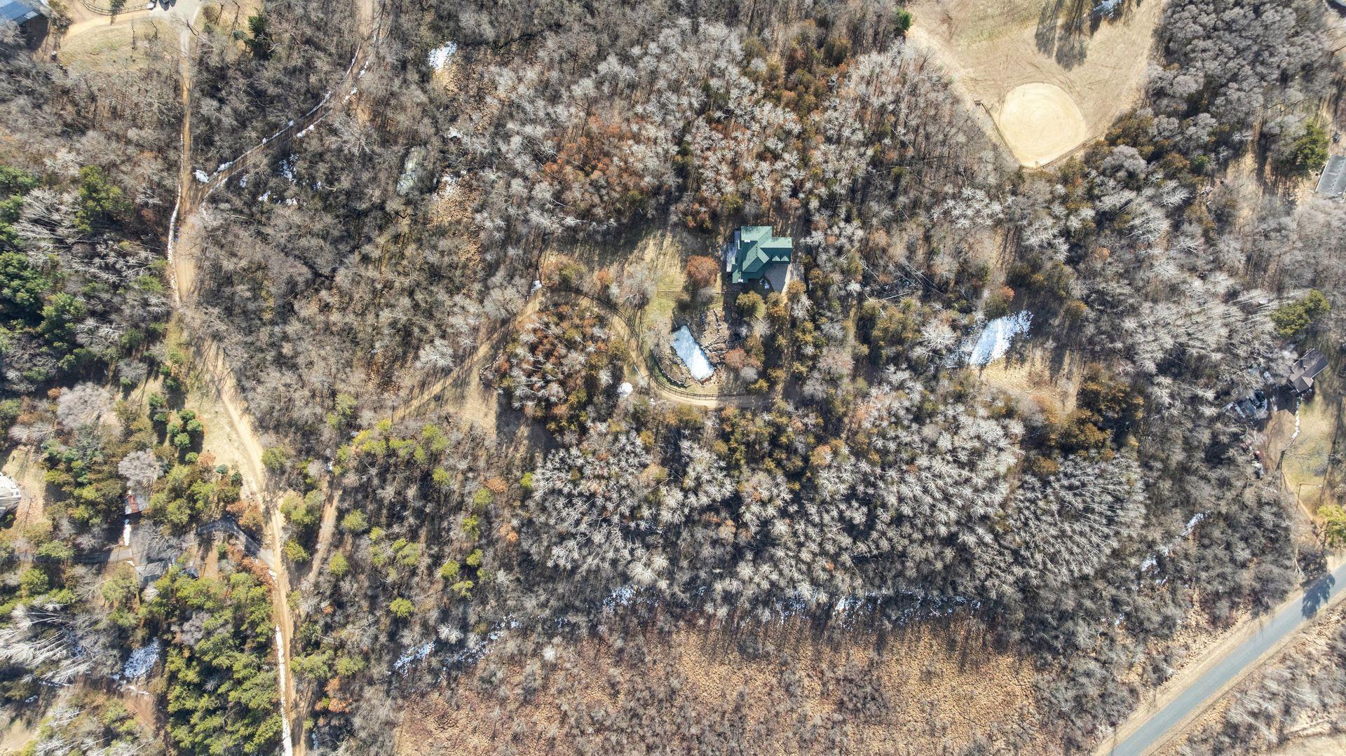 24 acres of wooded privacy and natural beauty