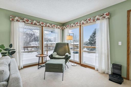 Natural light abounds with a 3 sided wrap around deck