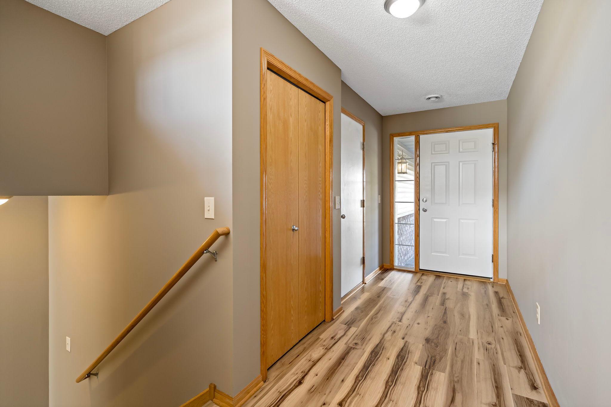Spacious front entrance with coat closet