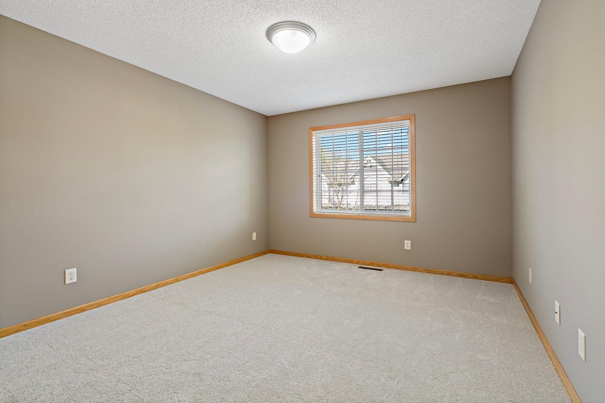 2nd upper level bedroom with new carpet & paint