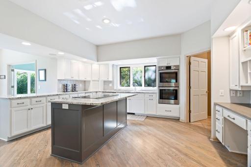 Open, updated kitchen with high end stainless steel appliances