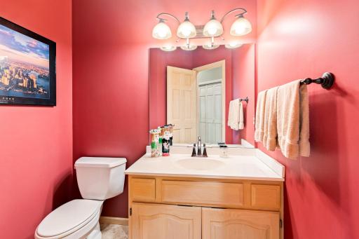 Powder room adjacent to laundry and garage