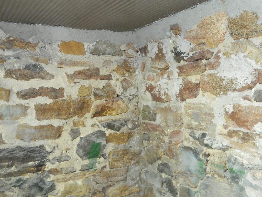 Basement foundation with rim joist sprayed with foam insulation.