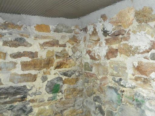 Basement foundation with rim joist sprayed with foam insulation.