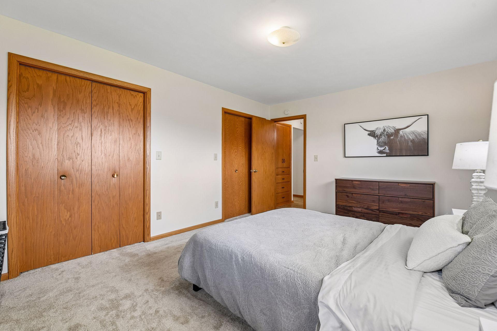 Primary bedroom has tons of natural light and two large closets