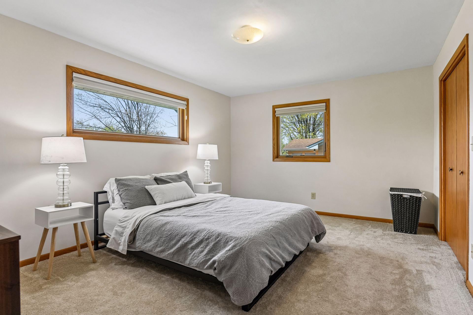 Primary bedroom has tons of natural light and two large closets