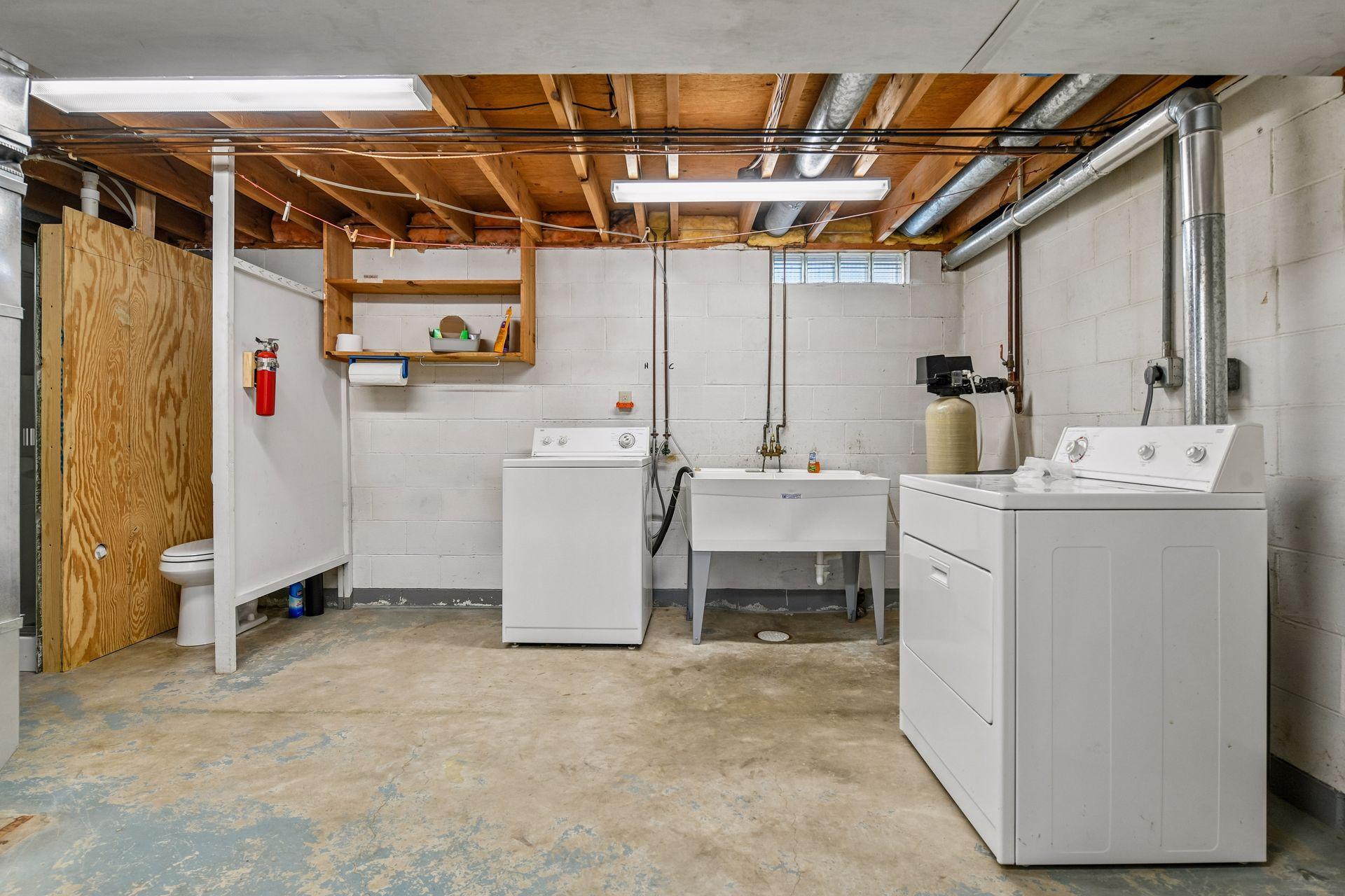 Lower level laundry and bathroom set up ready for your updates