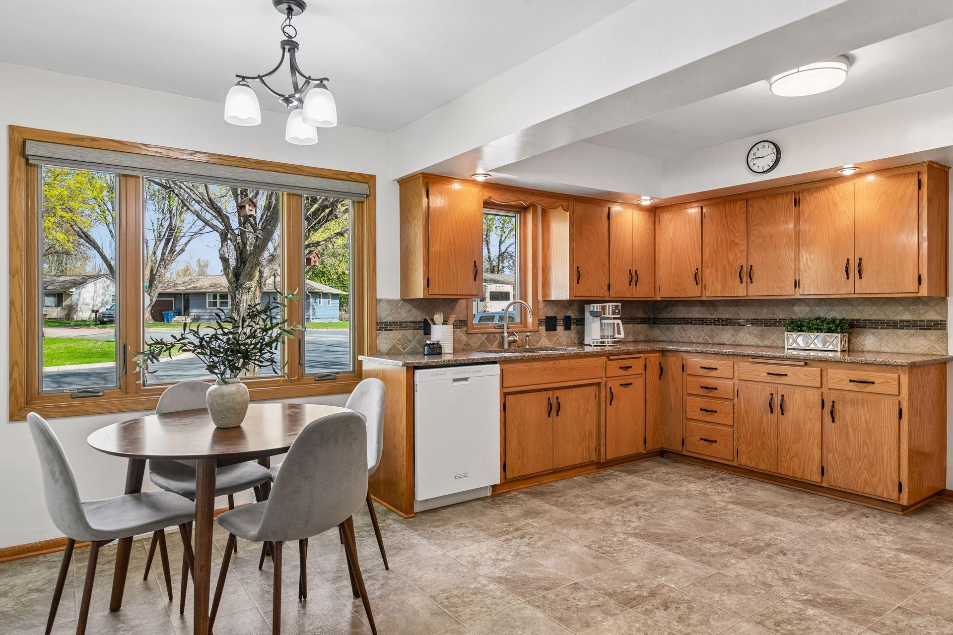 As you enter the home you are greeted by sunlit eat-in kitchen with a cozy breakfast nook tucked under a big window that pulls in light all morning.