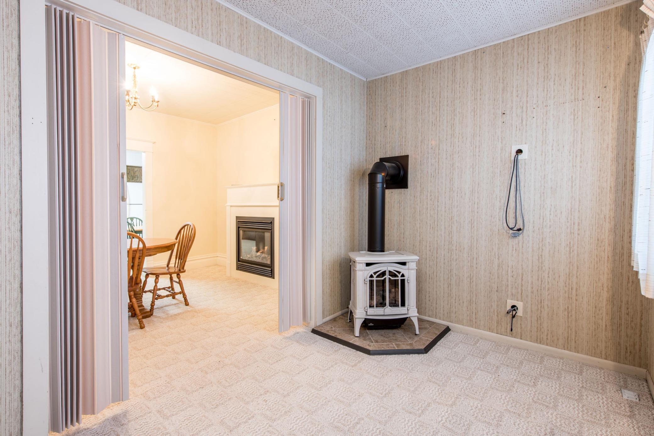 Den with free standing fireplace.