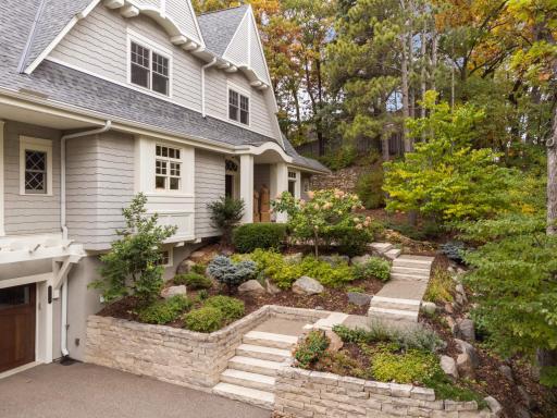 Meticulously manicured yard with native plants and natural materials
