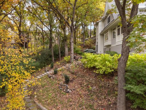 Winding paths connect the various features of this nearly 1 acre lot