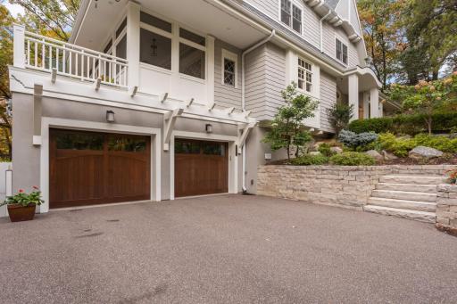 Double car garage with screened in porch and deck directly above.jpg