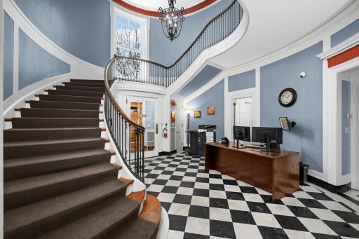Grand entrance with classic black and white marble floors.