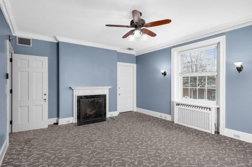 Example of one of the larger 2nd level offices with decorative fireplace.