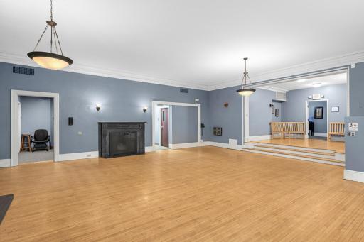 Lower level ballroom with hardwood floors.
