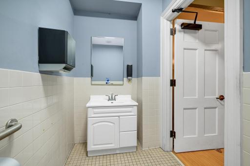 Lower level bathroom off elevator lobby.