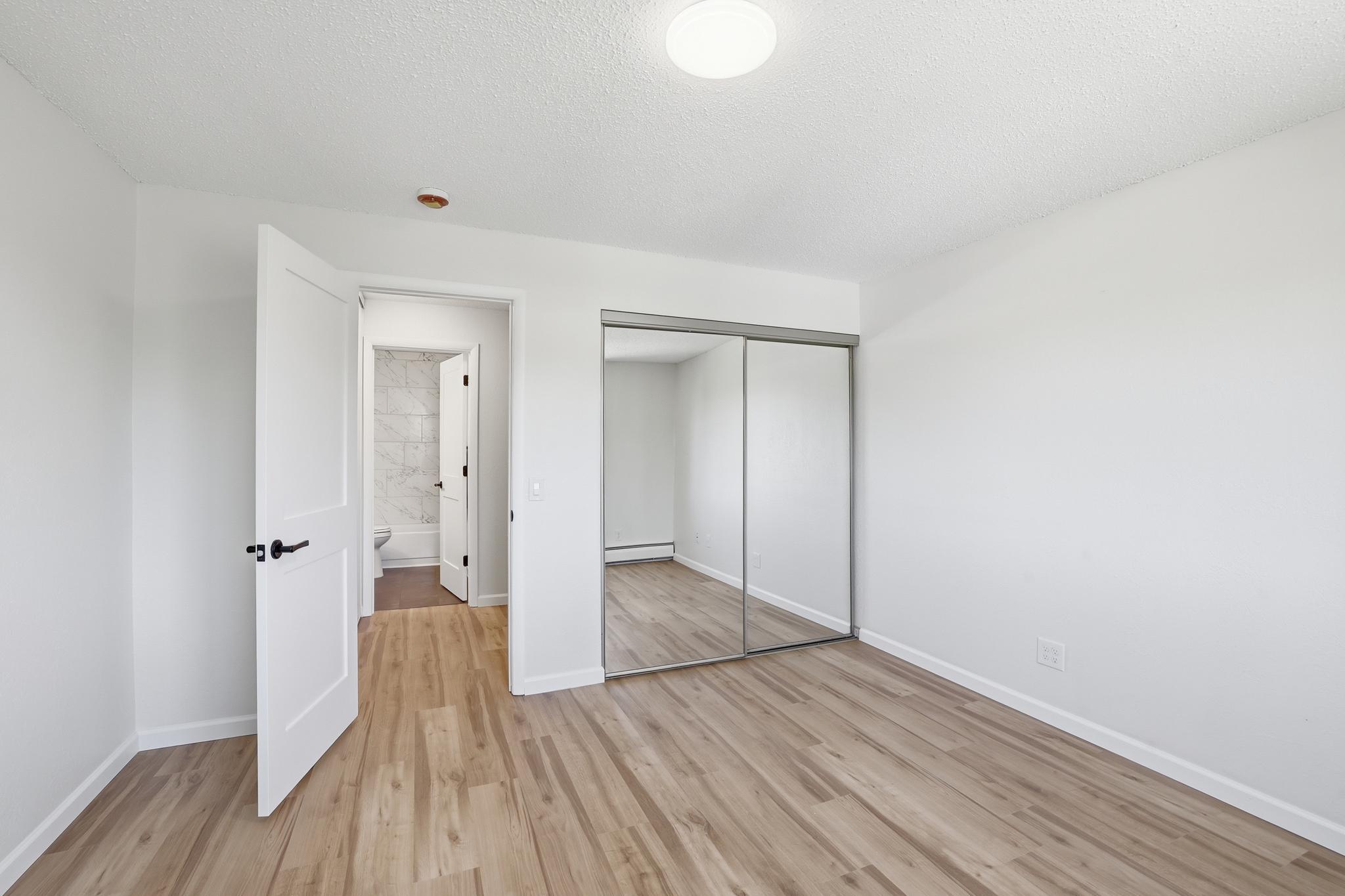 Bedroom has mirrored closet doors