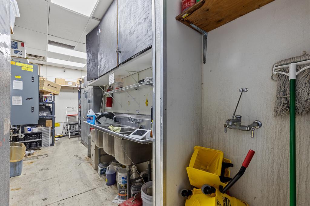 Mop area, extra sinks, & freezer
