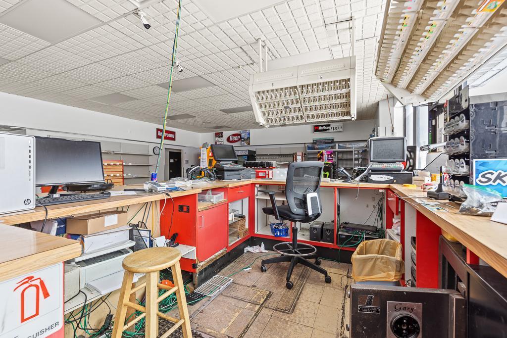 A couple POS systems in place, comfortable and spacious area for employees, and helpful storage areas under the counter.