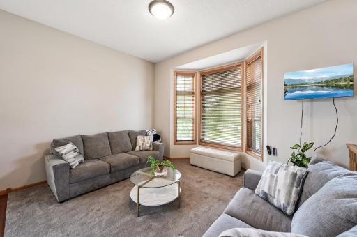 Living room has bay window which brings in lots of natural light.