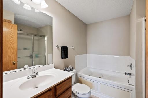 Primary bath has nice size jetted tub to relax in.