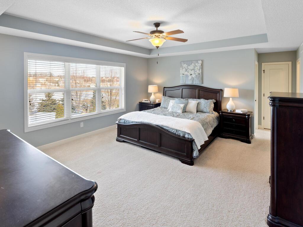Primary bedroom with private full bathroom and walk-in closet