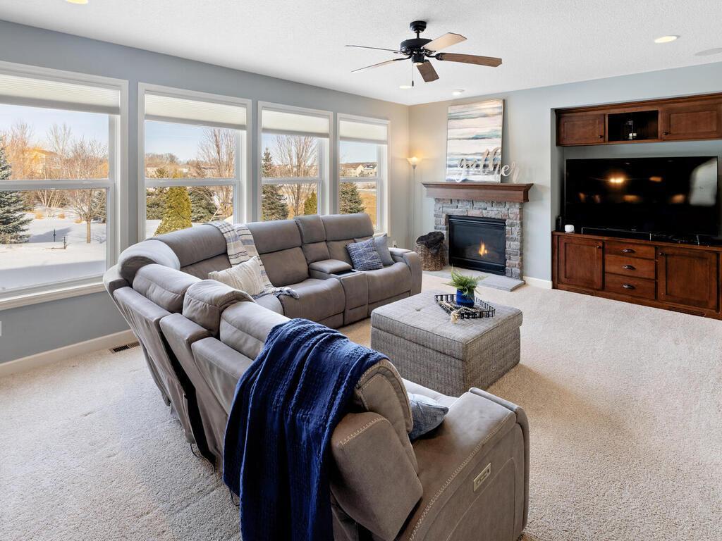 Family room with expansive windows and gas fireplace