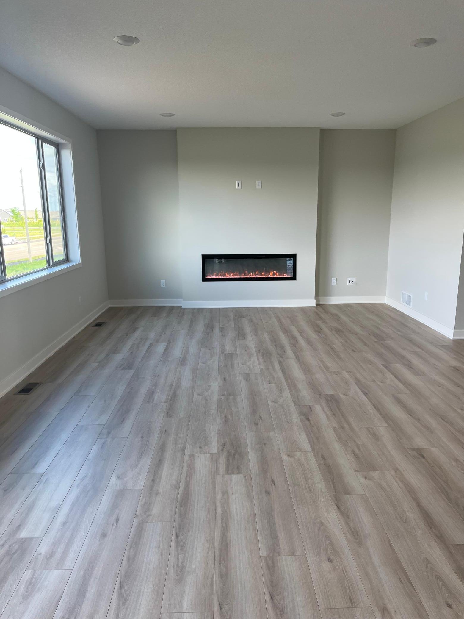 Large windows in the family room flooding in natural light