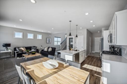 Formal dining space with elegant lighting and easy access to the kitchen *Photo of actual home