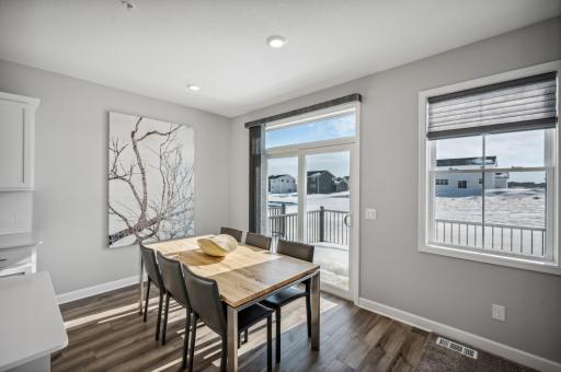 Dedicated dining area with room for a large table and views of the backyard *Photo of actual home