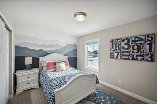 Comfortable secondary bedrooms ideal for guests, office, or flex use *Photo of actual home