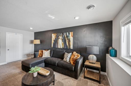 Versatile bonus space ideal for a home office, gym, or playroom *Photo of actual home