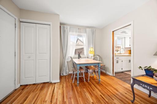 Home features in demand white trim, front door closet, & optional area for table. There is a pocket door between the kitchen and living room, too.