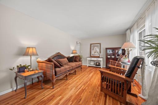 Large living room with flat ceiling (no popcorn) and fresh walls. Stunning refinished hardwood oak flooring.